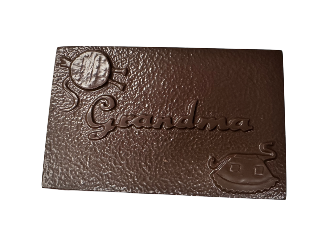 Grandma on chocolate bar with apron and yarn