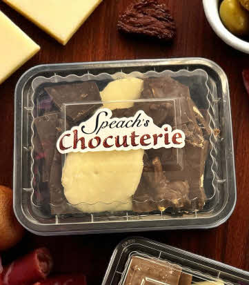 Chocuterie sample tray on a wooden charcuterie board